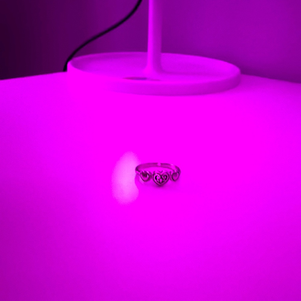 Heart plus swirl ring.